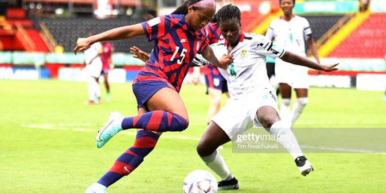 Trinity Byars of USA and Ghana's Rebecca Atinga compete for the ball in the Group D opener