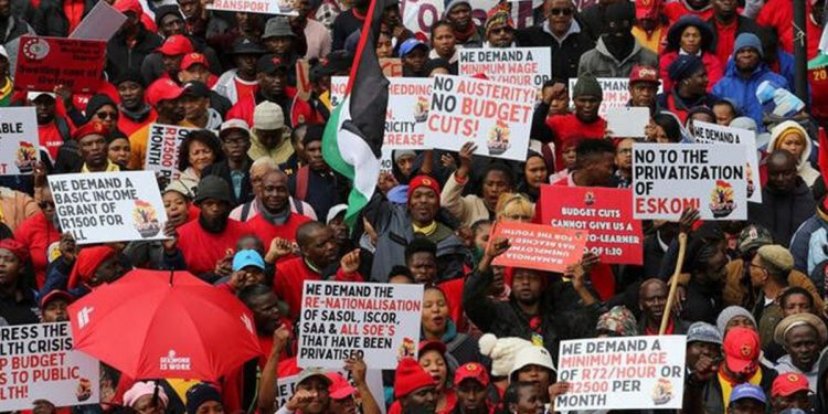 Members of South Africa's Congress of South Africa Trade Unions (COSATU), South African Federation of Trade Unions (SAFTU) and other labour unions embark on a nationwide strike over the high cost of living in Cape Town, South Africa, August 24, 2022. REUTERS/Shelley Christians