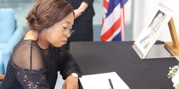 Madam Shirley Ayorkor Botchwey signing the book of condolence