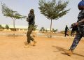 Police officers walk at the JSS Jangebe school, a day after over 300 school girls were abducted by bandits, in Zamfara, Nigeria Feb 27, 2021.REUTERS