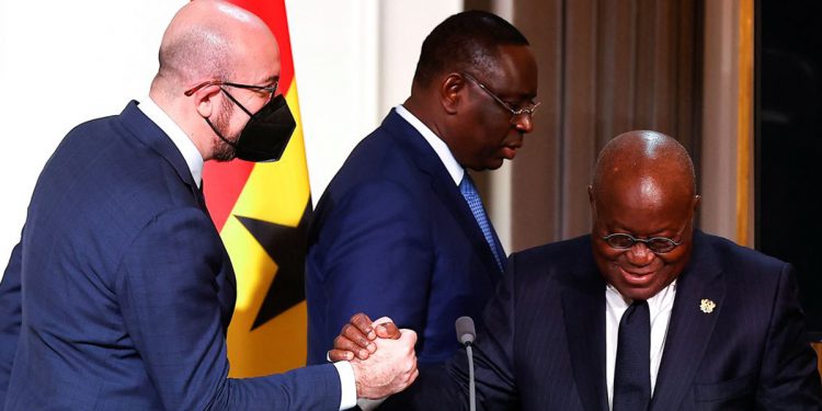 European Council President Charles Michel shakes hands with Ghana's President Nana Afuko Addo, as Senegal's President Macky Sall walks past, after a joint press conference with French President Emmanuel Macron on France's engagement in the Sahel region, at the Elysee Palace, in Paris, France, February 17, 2022. EPA-EFE/IAN LANGSDON/Pool via REUTERS