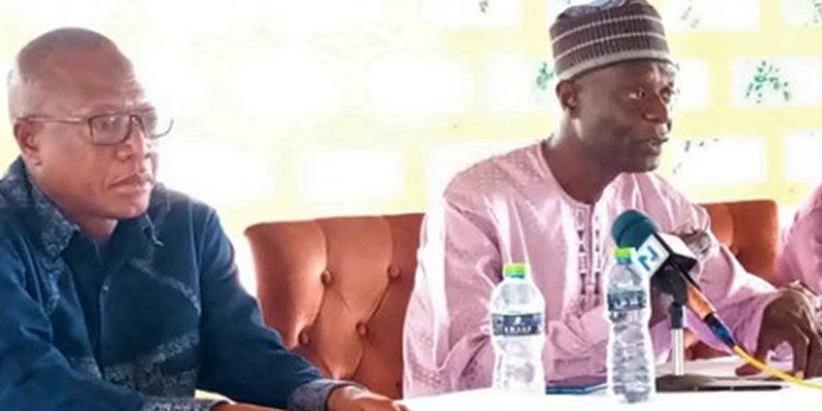 Shani Alhassan Shaibu (right), Northern Regional Minister, addressing the meeting. With him is Alhassan Issahaku (left), Chief Director of the Northern Regional Coordinating Council