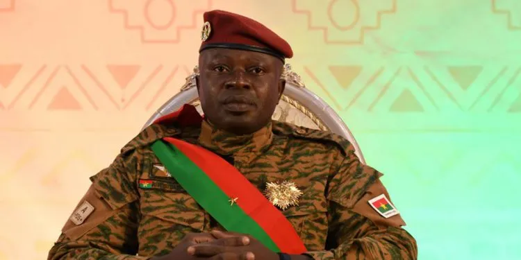 Lieutenant Colonel Paul-Henri Damiba, who led Burkina Faso's military coup in January, sits as he attends his sworn in ceremony for a second time as president to lead a three-year transition after a national conference approved a transitional charter in Ouagadougou, Burkina Faso March 2, 2022. REUTERS/Anne Mimault/File Photo