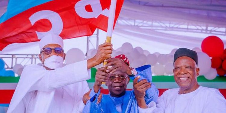 APC party's new presidential candidate Bola Tinubu raises a party's flag with Nigeria's President Muhammadu Buhari next to Abdullahi Adamu, the APC party chairman, during the party convention in Abuja, Nigeria June 7, 2022. Nigeria's Presidency/Handout via REUTERS