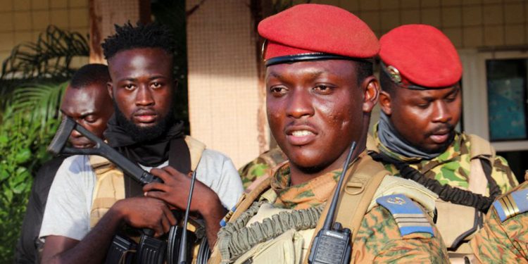 Burkina Faso's new military leader Ibrahim Traore is escorted by soldiers in Ouagadougou, Burkina Faso October 2, 2022. REUTERS/Vincent Bado//File Photo